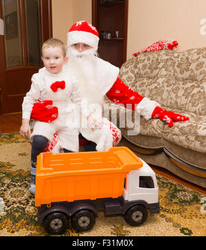 Santa Claus came to visit and brought the boy a gift Stock Photo