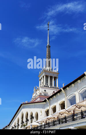 Building with a tower in the Empire style with facades decorating bronze and plaster sculptures Stock Photo