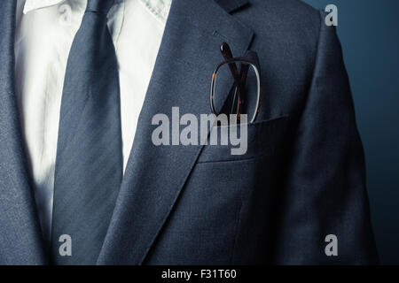 Businessman with glasses in his front pocket Stock Photo