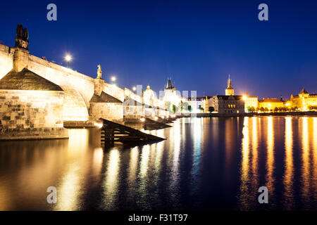 Night view of colorful old town and Charles Bridge with river Vltava, Prague, Czech Republic