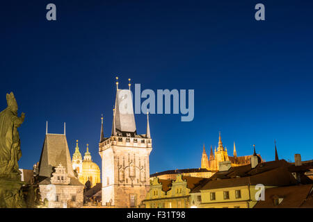 The night View on Prague Lesser Town with St. Nicholas' Cathedral, Bridge Tower and gothic Castle, Czech Republic Stock Photo