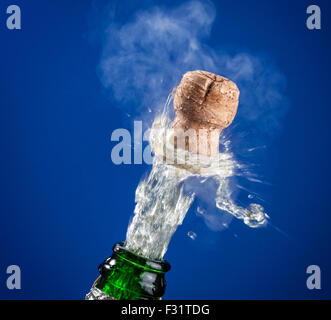 Opening of champagne bottle. Close up picture of cork. Stock Photo