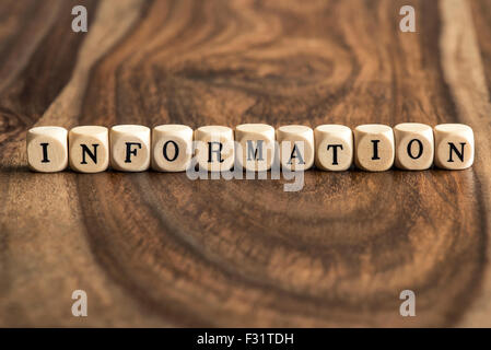 INFORMATION word background on wood blocks Stock Photo