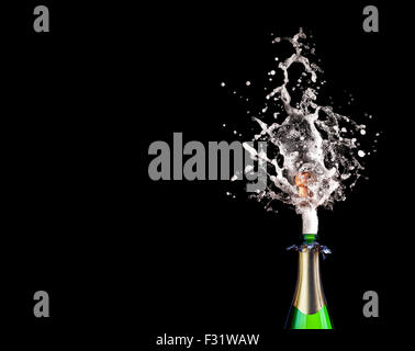detail of popping champagne on black background Stock Photo