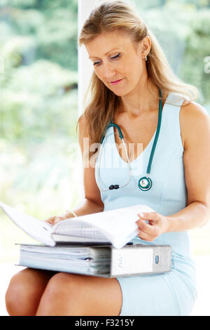 Tired Doctor at work Stock Photo