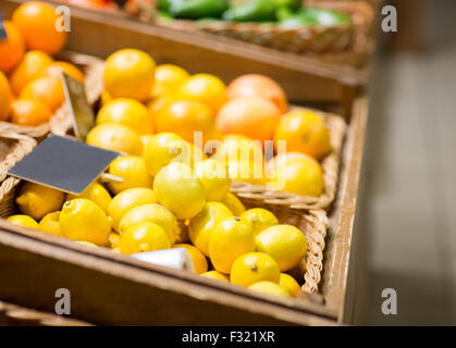 ripe lemons at food market Stock Photo