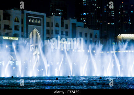 The Dubai Fountain display in front of the Souk al Bahar in downtown Dubai, UAE Stock Photo