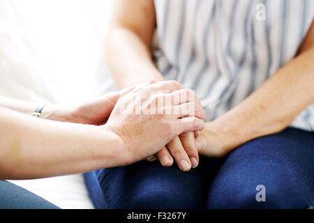 Woman consoling another Stock Photo