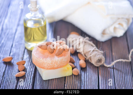 almond soap and oil on the wooden table Stock Photo