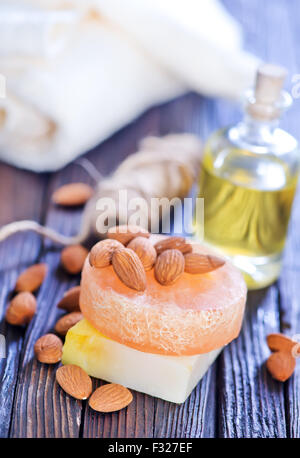 almond soap and oil on the wooden table Stock Photo