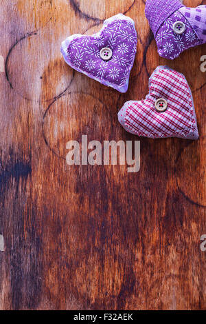 Love hearts on vintage wood, violet hearts Stock Photo