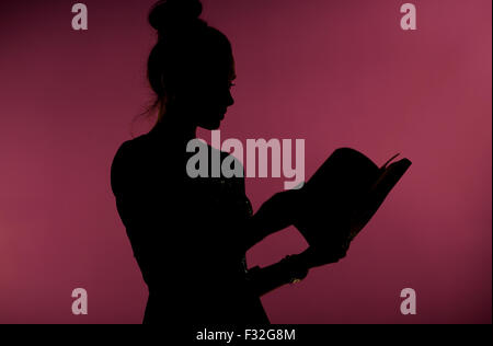 Lady reading an interesting book Stock Photo