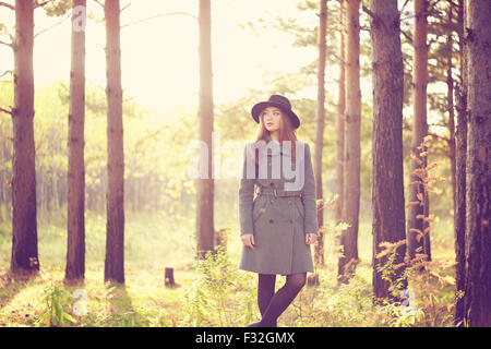 Portrait of young beautiful woman in autumn coat. Fashion photo Stock Photo