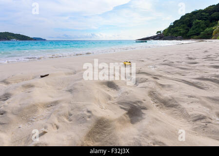 Visitors footprints on sand at beach near the sea during morning high tide remove traces of the chaos return to peaceful in Koh Stock Photo