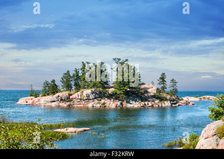 Landscape of an island on a sunny summer day at Killarney Provincial Park ontario canada Stock Photo