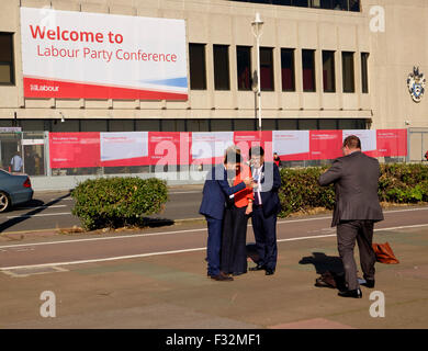Brighton, UK. 28th September, 2015. Delegates taking selfie in the sun outside Labour Party conference at the Brighton Centre Credit:  Scott Hortop/Alamy Live News Stock Photo