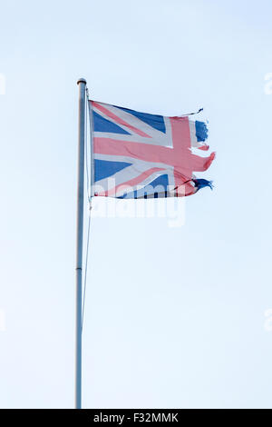Torn or ripped Union Jack flag, UK Stock Photo