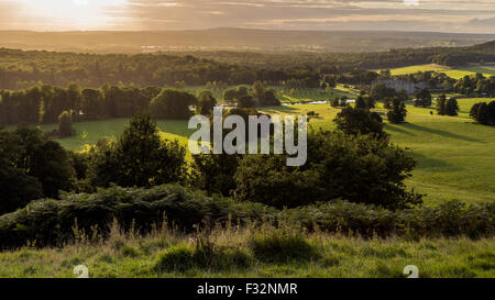 A view of the sunset over Longleat Estate and Safari Park from Heavens Gate in Warminster, UK Stock Photo