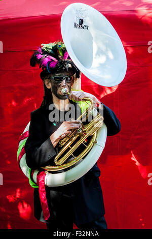 Beorma Border Morris dancer in costume with his sousaphone Stock Photo