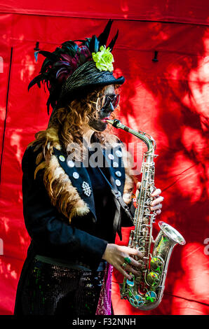 Beorma Border Morris dancer in costume with her saxophone Stock Photo