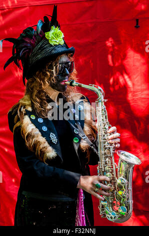 Beorma Border Morris dancer in costume with her saxophone Stock Photo