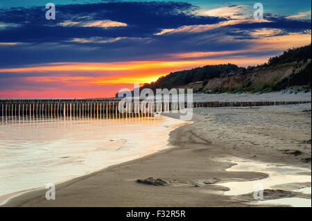 Sunset on the beach at Baltic Sea Stock Photo