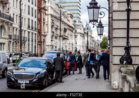 A Chauffeur Waits For His Client Outside The Royal Automobile Club, Pall Mall, London, England Stock Photo