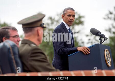 U.S. President Barack Obama looks toward incoming Chairman of the Joint Chiefs Marine Gen. Joseph Dunford during a change of responsibility ceremony at Joint Base Myer-Henderson Hall September 25, 2015 in Arlington, Virginia. Gen. Joseph Dunford succeeds Gen. Dempsey who retires from the military after 41 years in service. Stock Photo
