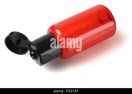 Orange Plastic Cosmetic Bottle Lying on White Background Stock Photo