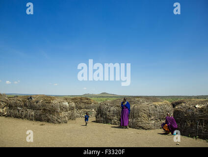 Tanzania, Arusha region, Ngorongoro Conservation Area, maasai women with child outside their home Stock Photo