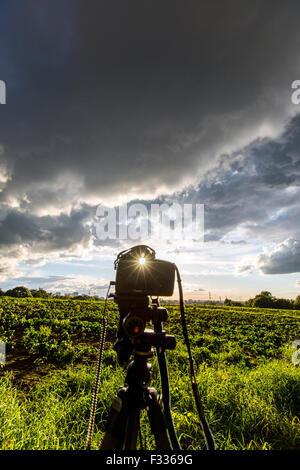 Thick, dark storm clouds in the evening sky, camera on a tripod, landscape photography, Stock Photo