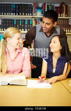 Group of students learning together in library Stock Photo