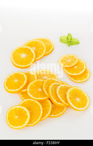 Orange slices formed in a stack, isolated on white Stock Photo - Alamy