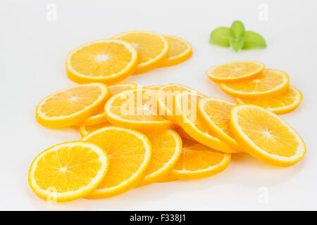 Orange slices formed in a stack, isolated on white Stock Photo - Alamy