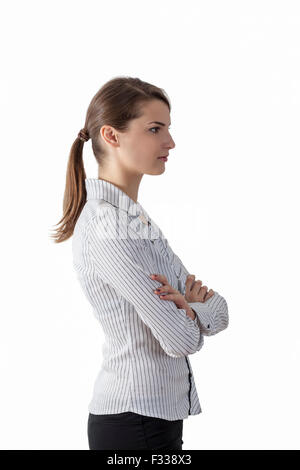 Profile of a young woman with ponytail against a white background. Stock Photo