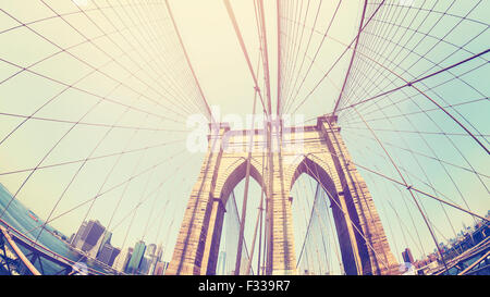 Retro stylized photo of Brooklyn Bridge, fisheye lens, NYC, USA. Stock Photo