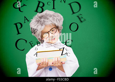 Composite image of dressed up pupil holding books Stock Photo