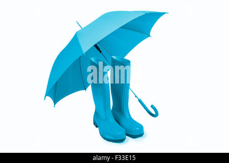 Blue rubber boots and umbrella isolated Stock Photo