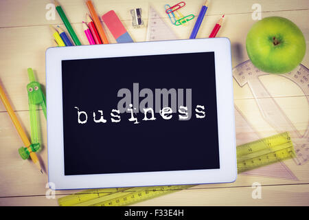 Business against students table with school supplies Stock Photo