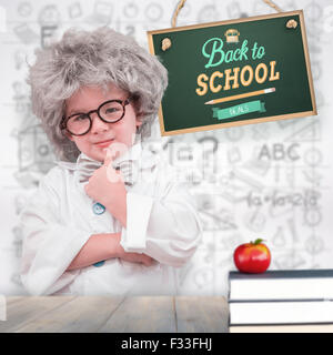 Composite image of cute pupil in lab coat Stock Photo