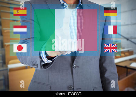 Composite image of focused businessman pointing Stock Photo