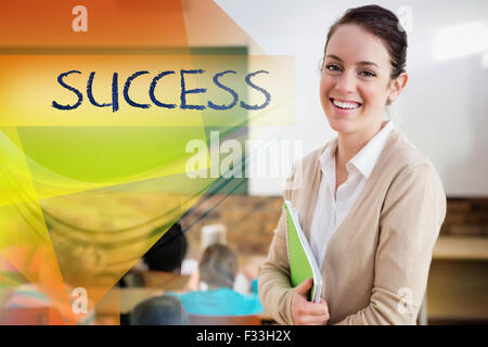 Success against pretty teacher smiling at camera at back of classroom ...