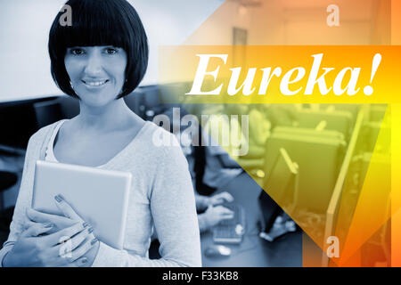 Eureka! against teacher with tablet pc Stock Photo