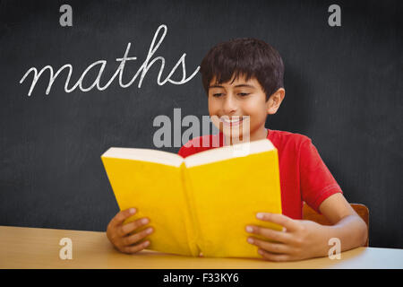 Maths against blackboard Stock Photo