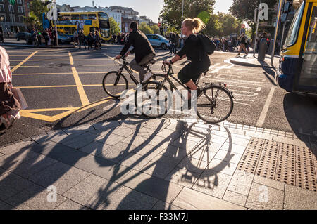 Cyclists on O'Connell Street in Dublin, Ireland Stock Photo