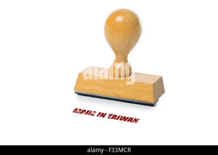 Made in Taiwan printed in red ink with wooden Rubber stamp isolated on white background Stock Photo