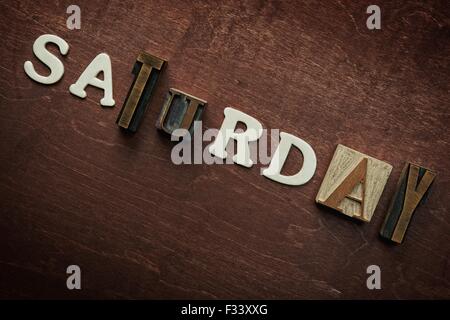 The word Saturday written on wooden background Stock Photo