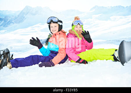 teenage girls snowboarding in the Alps. Stock Photo