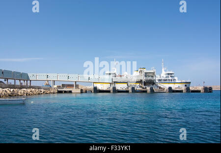 Ferry boat moored in the terminal to Gozo and Comino islands on a sunny day in September Stock Photo