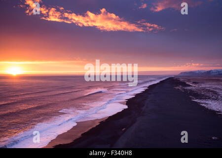 the beach looking west from Dyrhólaey at dusk, Iceland Stock Photo